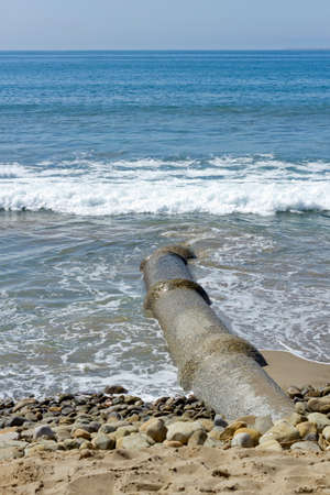Rain water drainage pipe near Ventura ocean beach, Californiaの写真素材