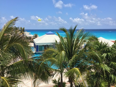 Cancun Quintana Roo Mexico  May 17 2015: Recreational parasailing above Caribbean sea at Solymar Beach and Resort hotel Cancun Mexicoのeditorial素材