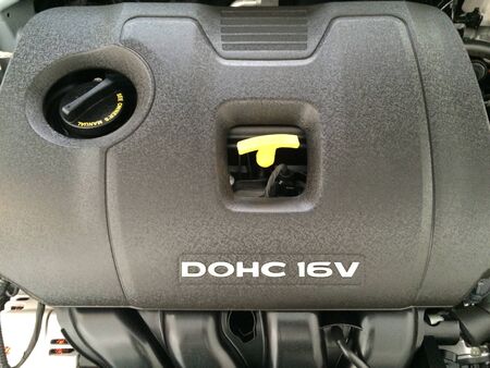 Top cover of car engine with dipstick and oil change access shaft