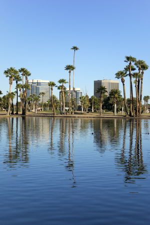 Phoenix downtown as seen across the lake in Encanto Park, Arizona; Copyspaceの写真素材