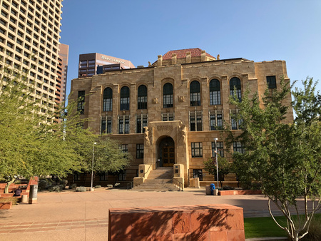 PHOENIX, AZ, USA - DECEMBER 14, 2017: Historic Phoenix City Hall contrasted with a modern...