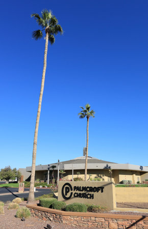 Phoenix, AZ - November 11, 2023:  Road sign and open entrance with tall palms leading to Palmcroft Church located along major city avenue in North-West Phoenix, Arizonaのeditorial素材