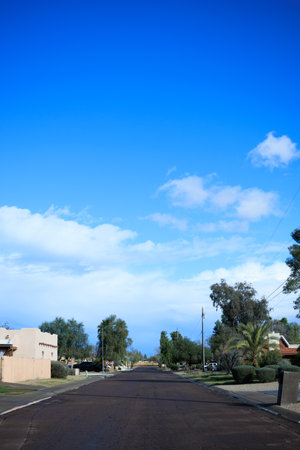 Clean fresh washed residential street in Phoenix after warm Arizona winter rain stormの写真素材