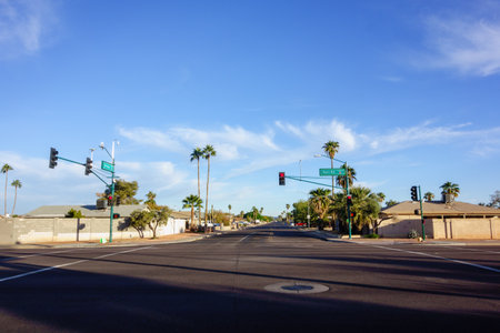 Crossroad at Bell road and 39th avenue with no traffic during early weekend morning in winter, Phoenix, Arizonaの写真素材