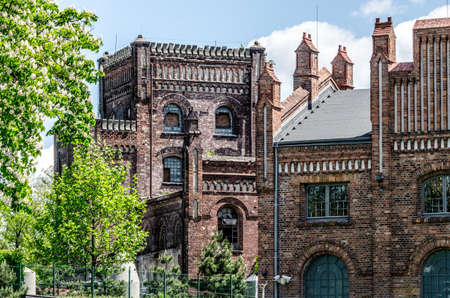 Katowie, Silesia, Poland; May 26th, 2021: Historic Katowice coal mine buildings in a neo gothic...