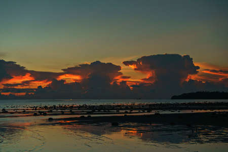 Amazing Sea Sunset with huge clouds on islandの写真素材