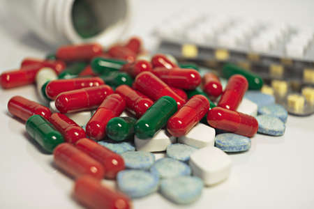 Supplements and medications, a pill bottle and blister packs, close-upの写真素材