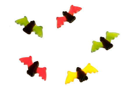 multicolored gummy jelly bat candies over white backgroundの写真素材
