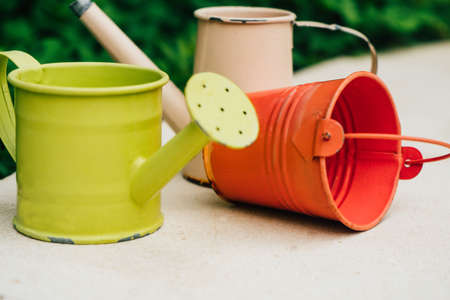 Colorful watering cans for plants at flowersの写真素材