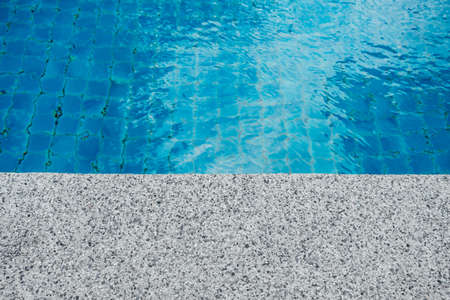 Pure blue water the pool. Water caustic backgroundの写真素材