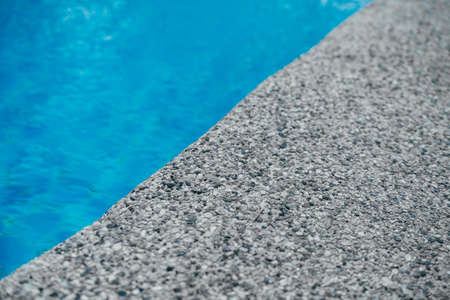 Pure blue water the pool. Water caustic backgroundの写真素材