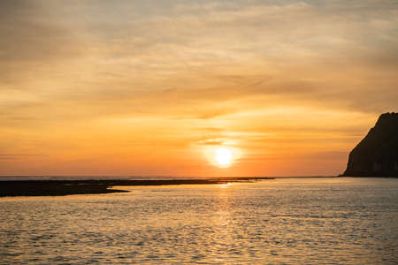 Beautiful red tropical sunrise on the beachの写真素材