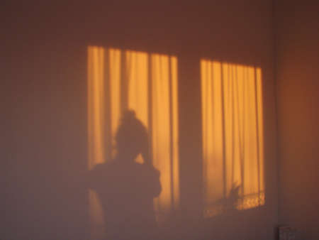 Silhouette of a person watching the sun
