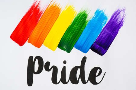 Love is Love slogan and flag with the LGTBI colors, red, orange, yellow, green, blue and purple made...