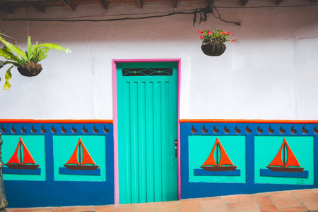 Brightly decorated door and window in a village in Colombiaの写真素材