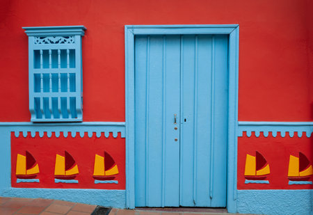 Brightly decorated door and window in a village in Colombiaの写真素材