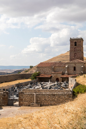 Historic ruins in Atienza, Guadalajara, Spain display remnants of ancient architecture surrounded by arid landscapes and dramatic clouds, illustrating a rich cultural heritage.の写真素材