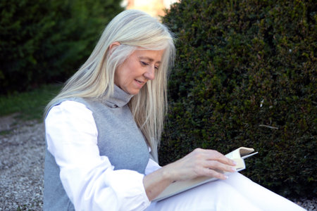 A woman with long, flowing hair enjoys a peaceful afternoon in a lush garden. Dressed in classic 50s...