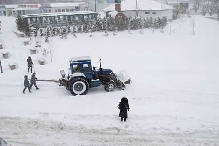 Agrimotor removes snow on the street のeditorial素材