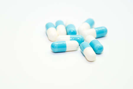 Assorted pharmaceutical medicine pills, tablets and capsules with white background.の写真素材