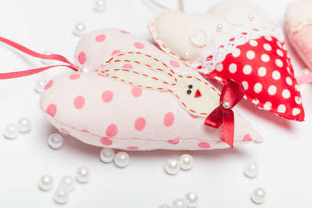 romantic and lovely beautiful heart with a hare and a bow close-up on a white background for a...