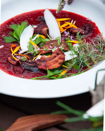 View of a decorated beetroot soup. Beetroot, fresh herbs, ginger ..の写真素材
