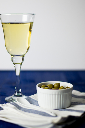 Olives and white wineの写真素材