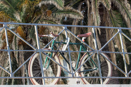 Bike locked on fence in Nice, Franceの写真素材