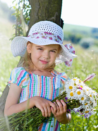 Little girl with a bouquetの写真素材