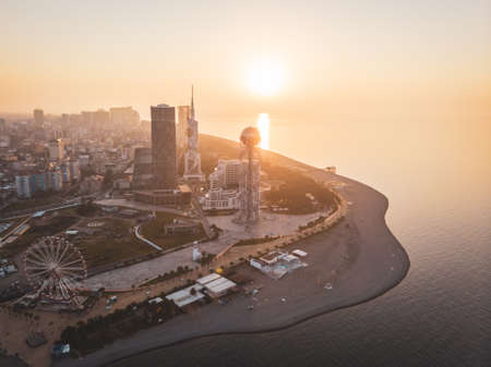 Batumi city waterfront with beach and amusement  attractions and incredicle archotectral buildings with sunset in the backgoundのeditorial素材