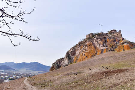 Kveshi fortress with pathway and cross on top. Historical and cultural heritage n Georgia.の写真素材