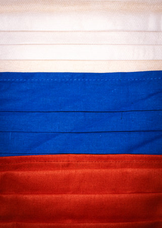 Medical face masks close up forming Russian national flag. Concept of corona virus outbreak.の写真素材