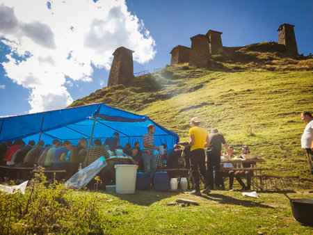 Upper Omalo, Tusheti,Georgia - 28th august, 2020.Tushetoba - traditional Tusheti festival.Tushetians having feast party under tent on Keselo hill.のeditorial素材