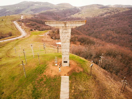 Didgori, Georgia - 17th april, 2021: Aerial tilt up view woman tourist walk up stairs in Didgori -...