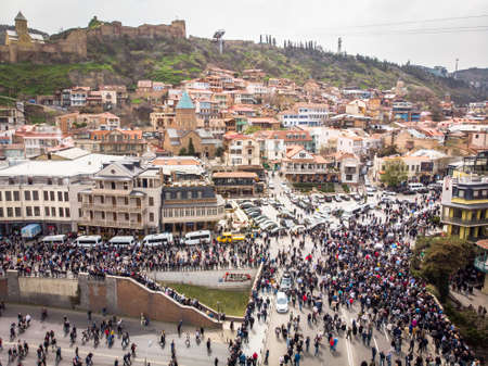 Tbilisi, Georgia - 9th april, 2021: People walking in streets in Georgia capital. Aerial view...