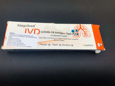 Vilnius, Lithuania - 29th June, 2021: Singclean Covid-19 antigen test kit packet on table.
