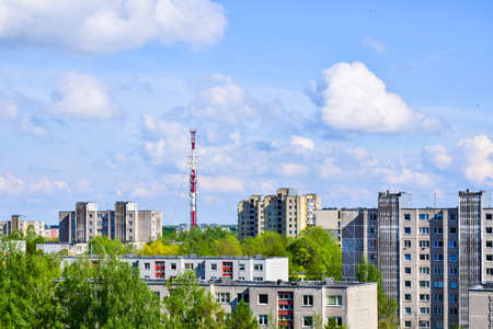 Siauliai city panorama with traditional soviet type block house and TV tower background