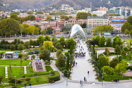 Tbilisi, Georgia- 4th october, 2021: Zoom in time-lapse of tourist walking in Rike park in city center capital caucasus.のeditorial素材