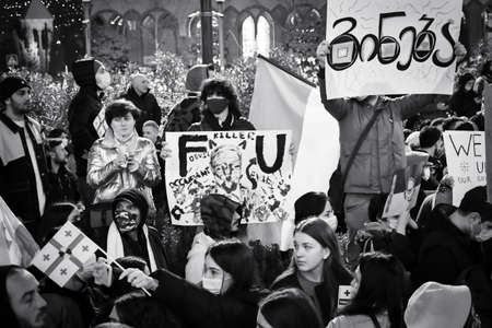 Tbilisi, Georgia - 1st march, 2022: protestors together stand in protest by parliament against...