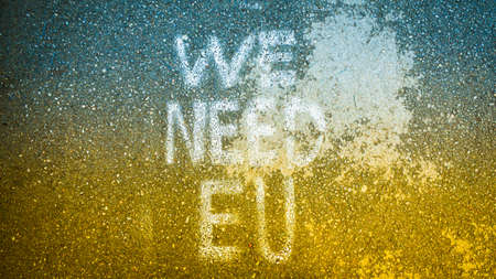 Written statement on the ground "we need EU". Ukraine Integration process to EU concept and solidarity in Europe. Stand with Ukraine. STOP WAR conceptの写真素材