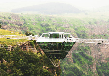 Diamond shape platform on glass bridge over scenic dashbashi valley in Georgia countryside. Famous modern bridge over valley in caucasusのeditorial素材