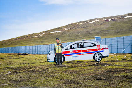 KArs, Turkey - 20th may, 2022: Cardboard police imitation by road in Turkey countryside. Traffic police in Turkiyeのeditorial素材