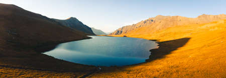 Aerial panorama close up blue Black rock lake panorama in scenic evening sunset light outdoors. Famous travel destination in Georgia. Hiking in Lagodekhi conceptの写真素材