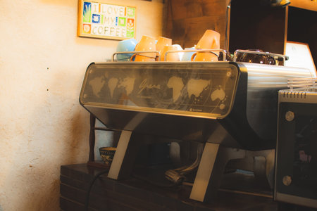 Dubai, UAE - 12th october, 2022: old vintage coffee machine on counter in cafe. Coffee museum in Dubai creek.のeditorial素材