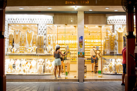 Dubai, UAE - 12th october, 2022 : tourist enter gold shop in gold souk in old Dubai. Famous sightseeing attraction in Dubai, UAEのeditorial素材