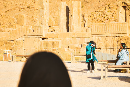 Persepolis, Iran - 8th june, 2022: Woman looking through a VR headset at Persepolis archeological museum tour display in Iranのeditorial素材