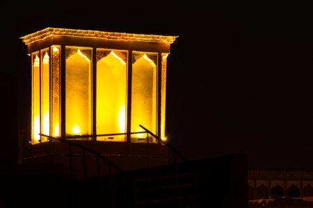 Wind catcher over house in Yazd city, Iran. At Night illuminated