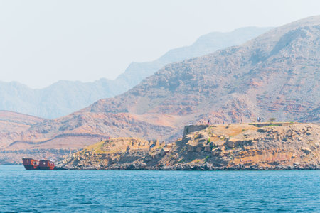 Tour boats and tourist on Mirellas island in Musandam. Oman. Middle east. Famous travel destination in Oman Khassab peninsulaの写真素材