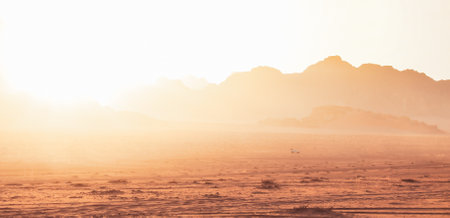 Jordanian desert in Wadi Rum, Jordan viewed from Lawrence's Spring. Wadi Rum is known as The Valley of the Moon and has led to its designation as a UNESCO World Heritage Siteの写真素材