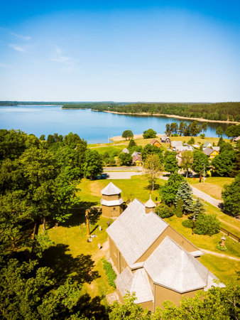 Aerial panning view beautiful iconic St.Joseph wooden stave church with no nails in famous Lithuania...